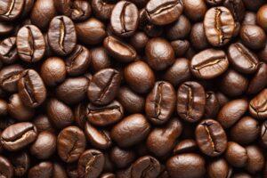 Freshly roasted coffee beans on a wooden table ready for brewing at a coffee shop in the morning